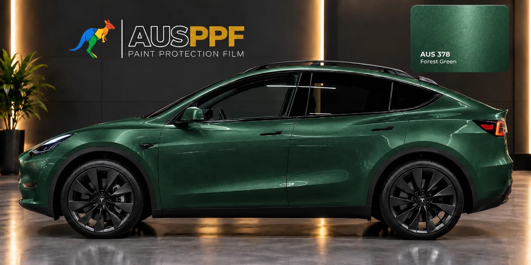 A vehicle wrapped in AusPPF Forest Green paint protection film, photographed in a showroom.