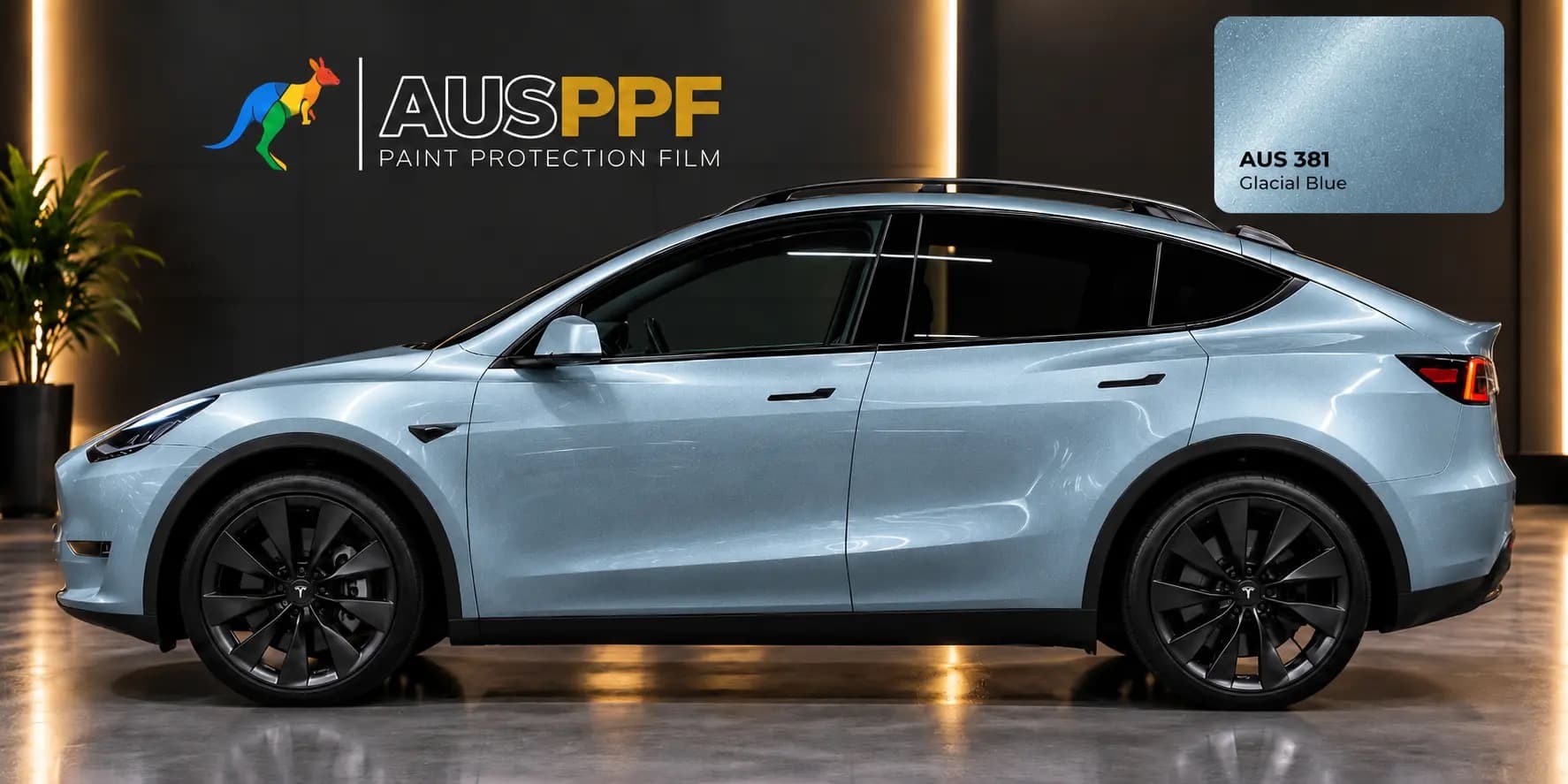 A vehicle wrapped in AusPPF Glacial Blue paint protection film, photographed in a showroom.