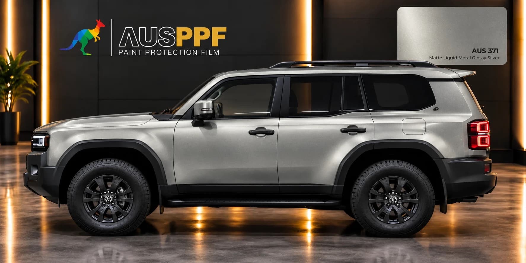 A vehicle wrapped in AusPPF Matte Liquid Metal Glossy Silver paint protection film, photographed in a showroom.