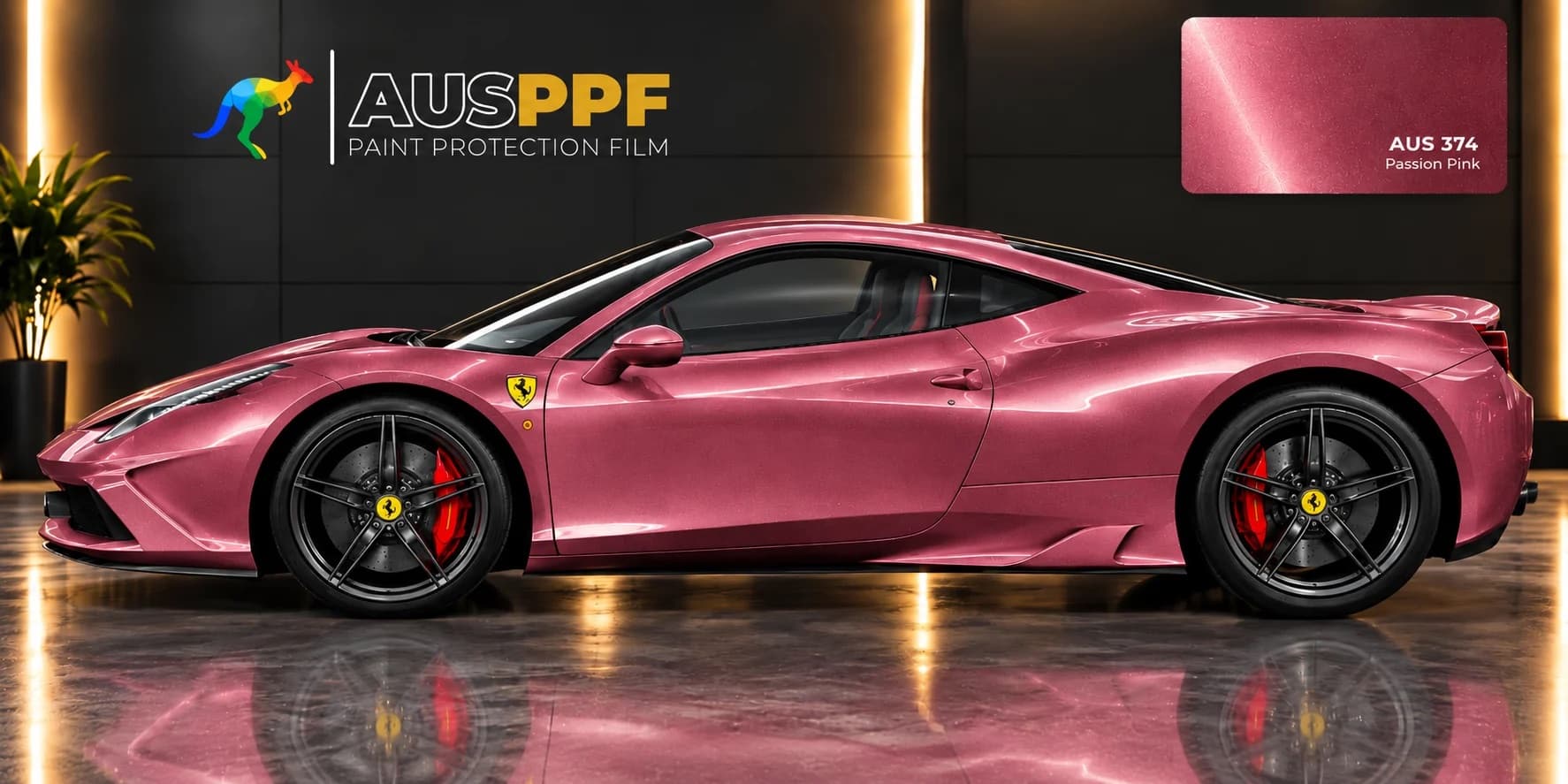A vehicle wrapped in AusPPF Passion Pink paint protection film, photographed in a showroom.