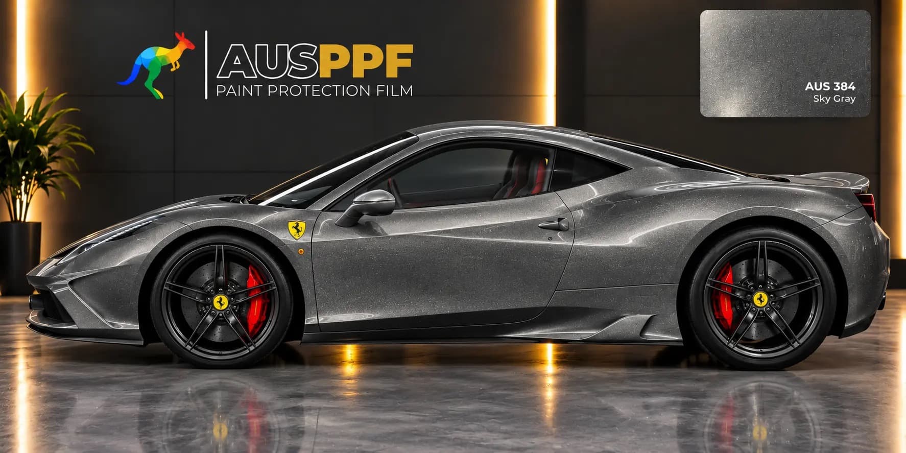 Another view of a vehicle wrapped in AusPPF Sky Gray paint protection film, in a showroom.